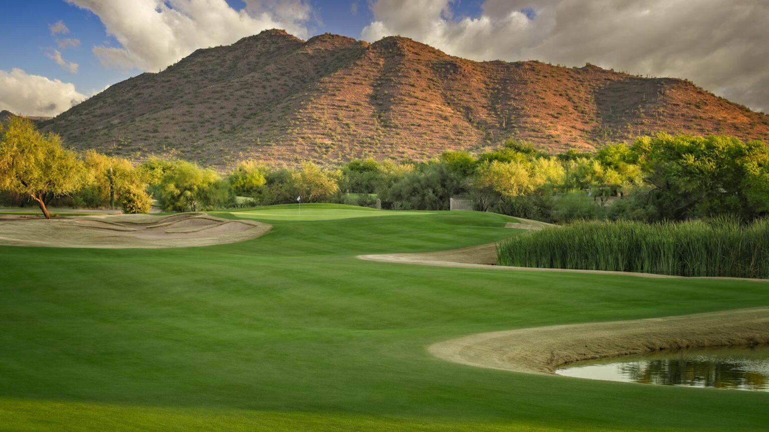 Dove Valley Ranch Golf Club green with desert mountains behind in Cave Creek, Arizona