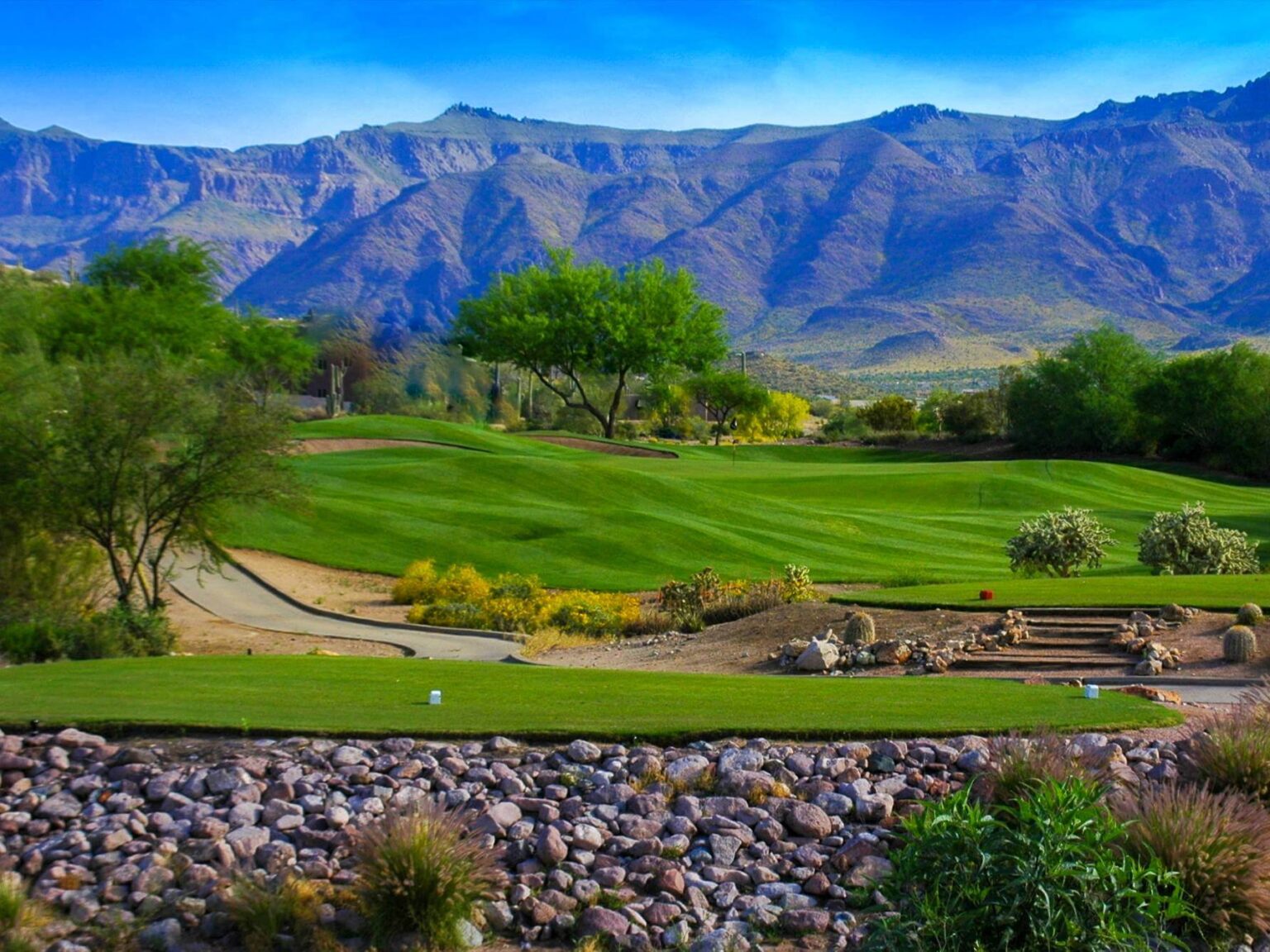 Sidewinder Course green with the Superstition Mountains behind at Gold Canyon Golf Resort, Arizona
