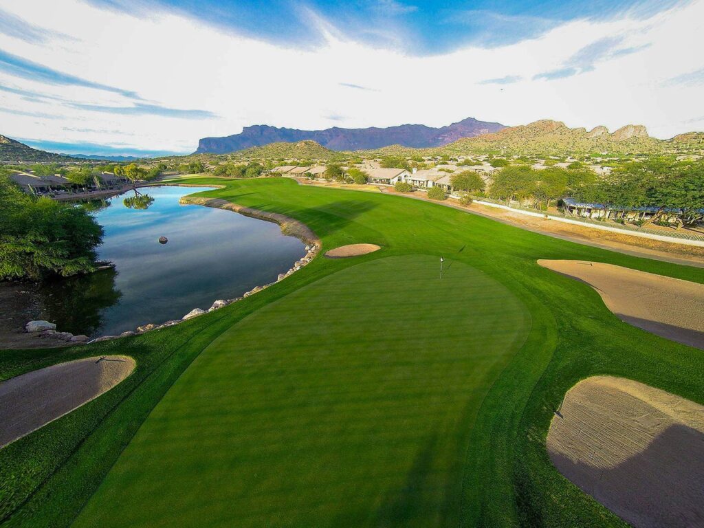 Sidewinder fairway and lake with the Superstition Mountains in the distance