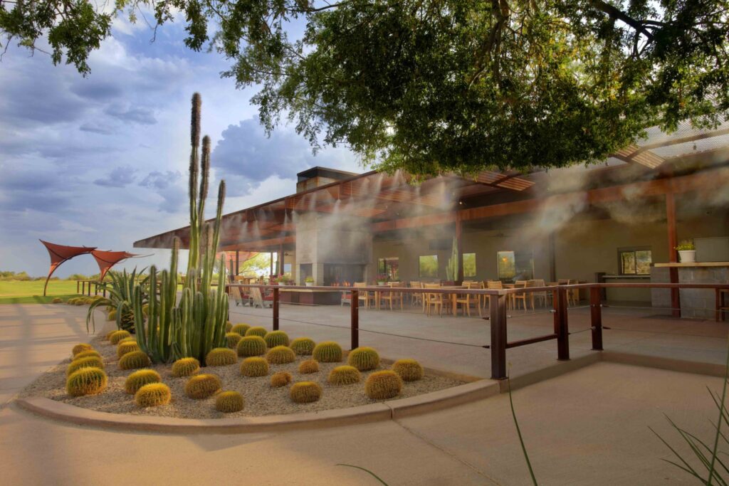 Longbow Golf Club clubhouse patio with desert landscaping