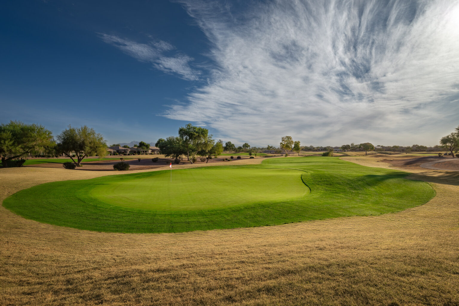 Power Ranch Golf Club green under a dramatic desert sky in Gilbert, Arizona