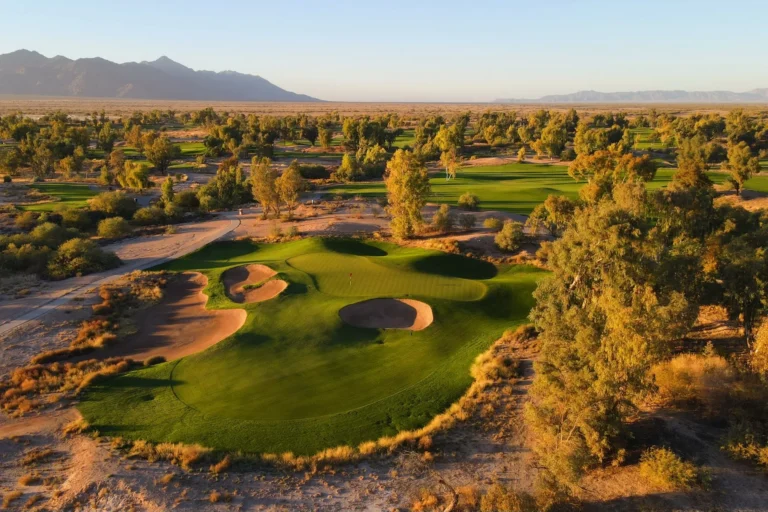 Aerial view of an Ak-Chin Southern Dunes green surrounded by native dunes and desert trees