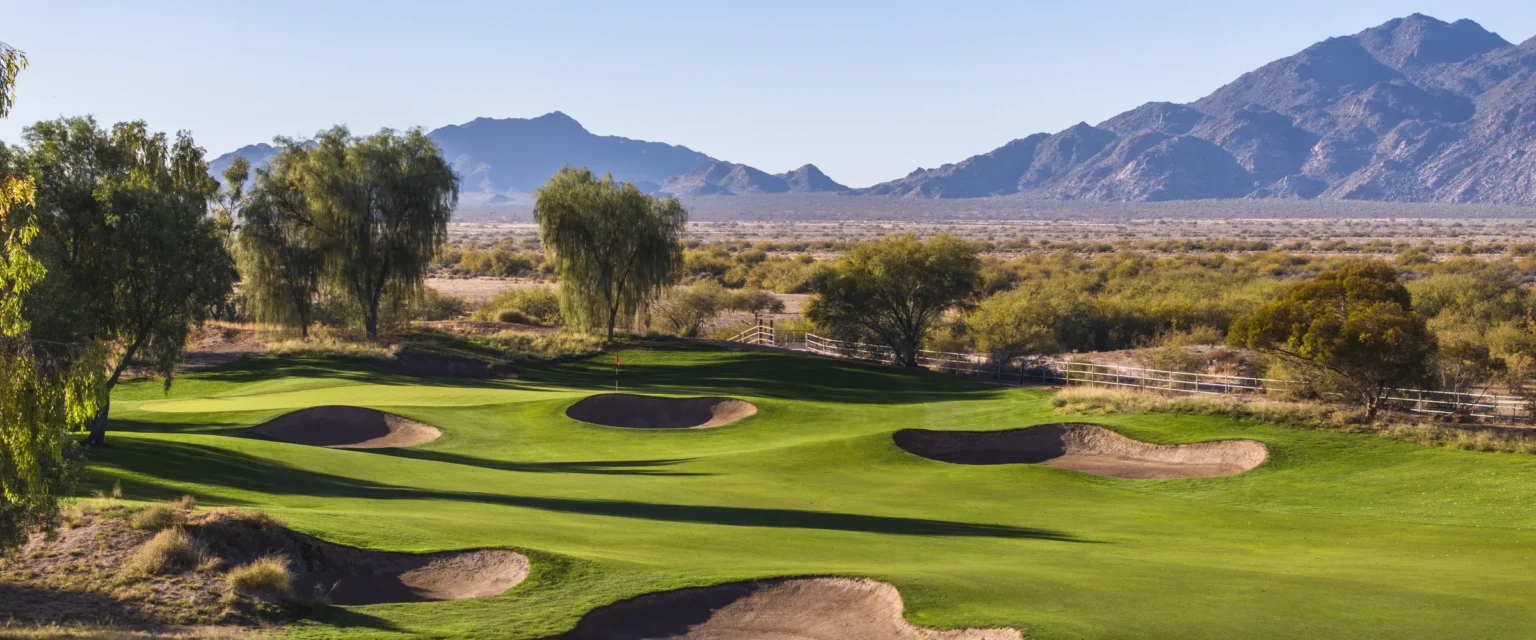 Ak-Chin Southern Dunes green and sand belt bunkers with desert mountains behind, Maricopa Arizona
