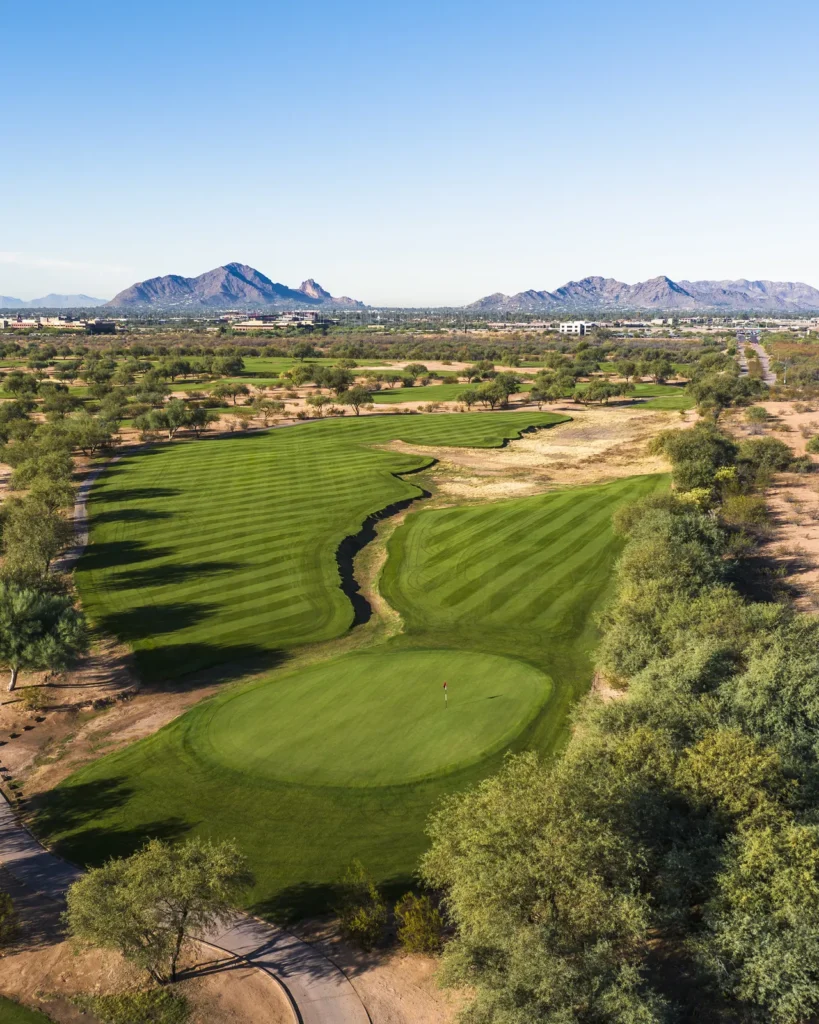 Full view of a Talking Stick O'odham hole from tee to green with Camelback Mountain beyond, Scottsdale Arizona